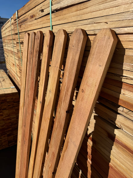 Redwood Fence Pickets upright in a row