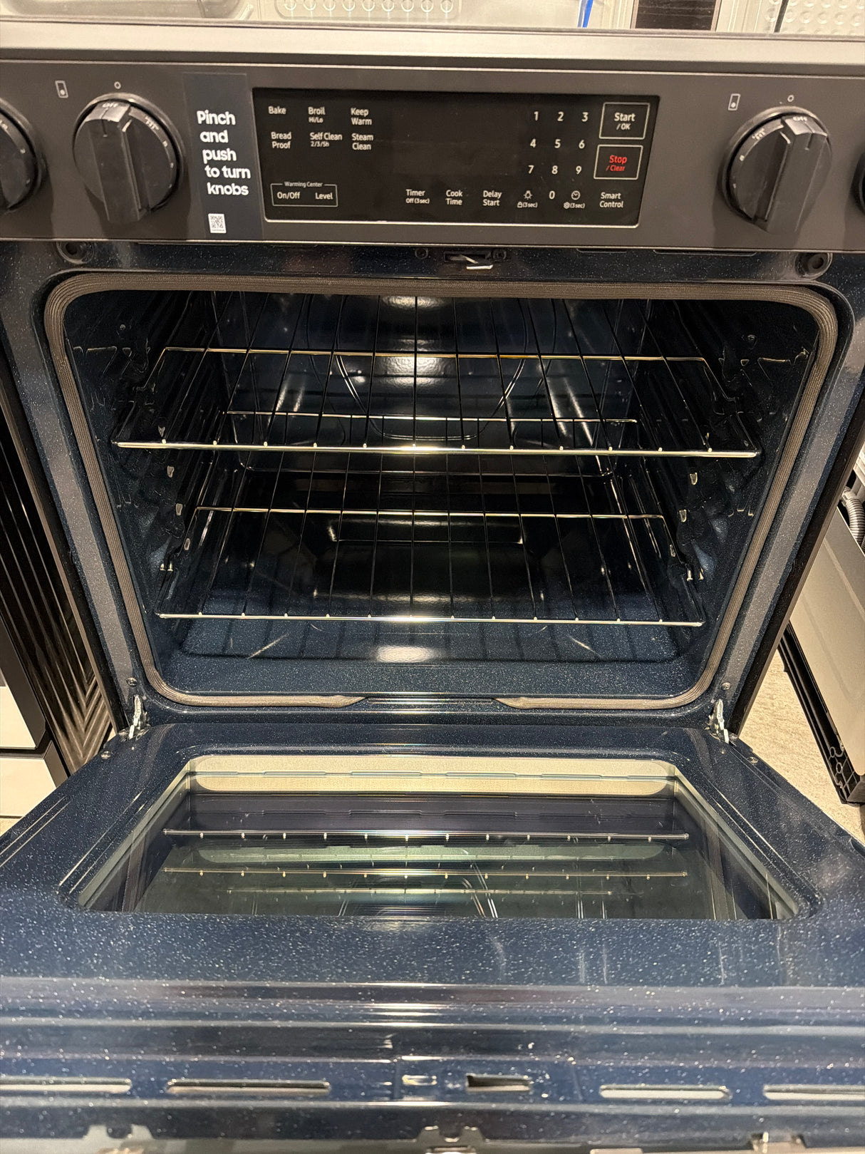 T12ID24 - Samsung NSE6DG8100SRAA 6.3 cu. ft. Slide-In Electric Range